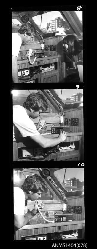 Photographic negative strip featuring three images of an AWA communication system on a boat