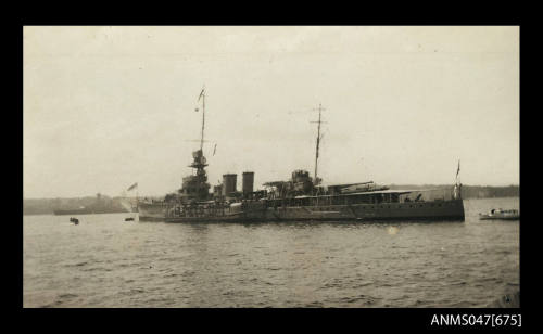 Light cruiser moored in harbour with oiler alongside