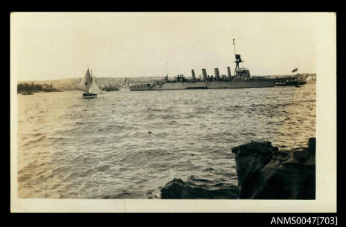 Warship [Chatham Class cruiser] moored in Sydney Harbour