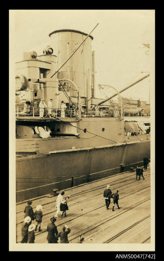 HMS HOOD docked at a wharf on its visit to Australia in 1924