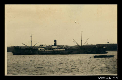 Unidentified cargo or passenger ship at anchor