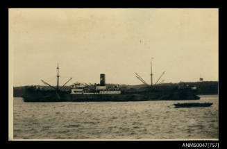 Unidentified cargo or passenger ship at anchor