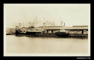 Cargo steamship berthed at a wharf