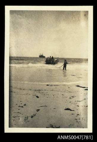 Longboat coming ashore on a beach