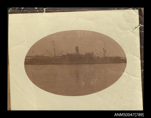 Photograph of a cargo/ passenger ship berthed at a wharf