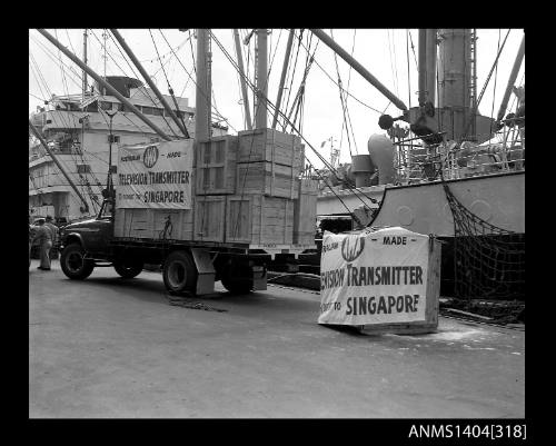 Photographic negative showing loading of the first AWA television transmitter for export to Singapore