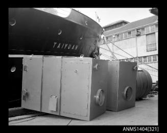 Photographic negative showing the ship TAIYUAN alongside a wharf with cargo on it