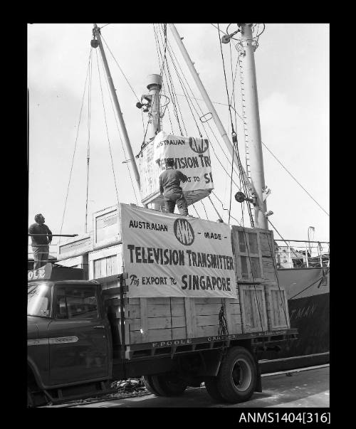 Photographic negative showing loading of the first AWA television transmitter for export to Singapore