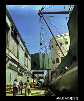 Photographic transparency showing cargo being loaded onto the ship TAIYUAN from a wharf