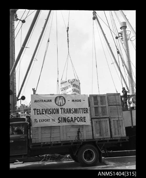 Photographic negative showing loading of the first AWA television transmitter for export to Singapore