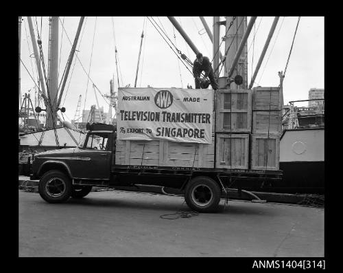 Photographic negative showing loading of the first AWA television transmitter for export to Singapore