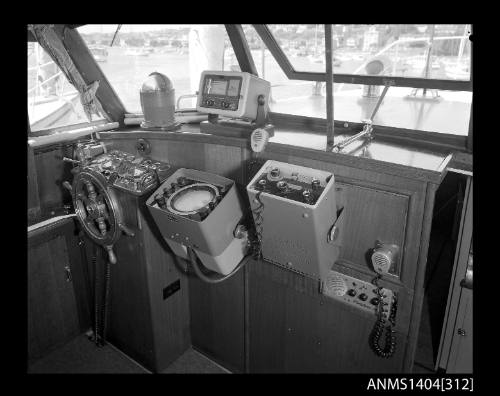 Photographic negative showing AWA brand marine communication devices on board a boat