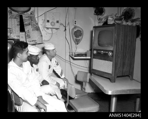 Photographic negative showing American sailors watching television on board a ship