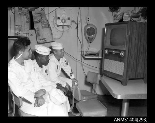 Photographic negative showing American sailors watching television on board a ship