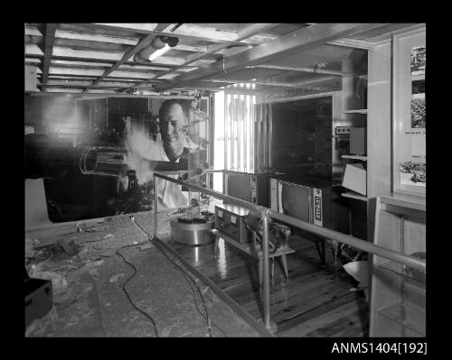 Photographic negative showing set up of an AWA company display on board a trade ship