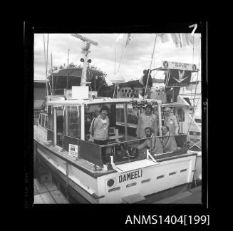 Photographic negative showing crew of an AWA display vessel at a boat show