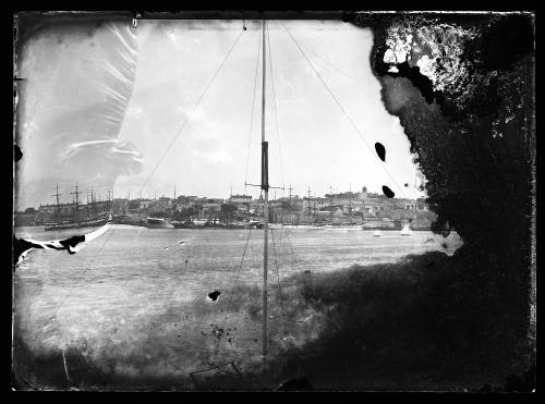 Glass plate negative showing a harbour foreshore, possibly looking across to Fort Macquarie and Observatory Hill, Sydney