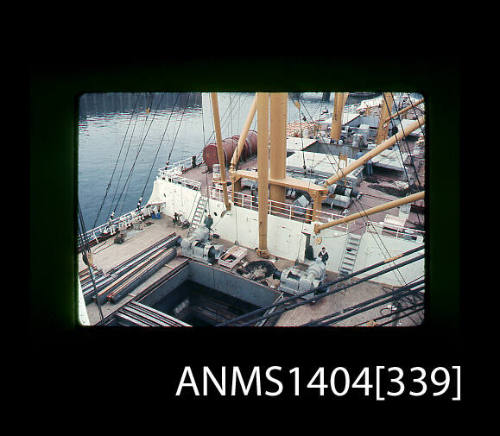 Photographic slide showing a view down into the hold of a cargo vessel