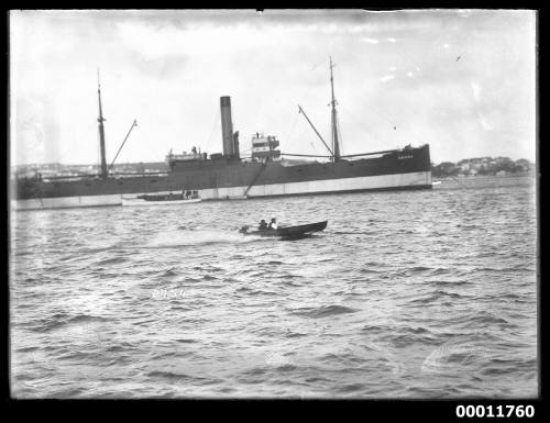 Speedboat BABY BOY flying past a steamer OMANA in the harbour