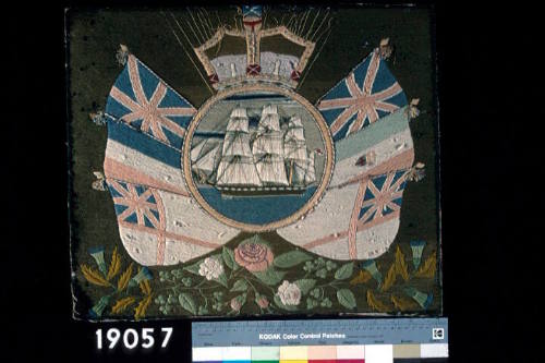 Sailor's woolwork picture with a ship of the line and flags