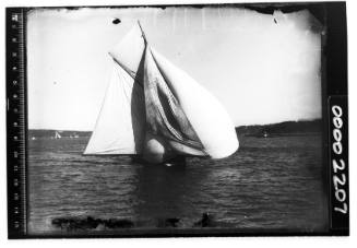 A gaff cutter sailing on Sydney Harbour, New South Wales, with the spinnaker billowing and the jib not full