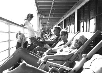 Sunbathing on a cruise liner's deck chairs : P&O promotional photograph