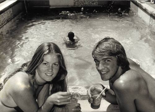 After a vigorous game of deck tennis, cricket or deck quoits, passengers relax with a drink on decks - and cool off with a refreshing dip in the pool
