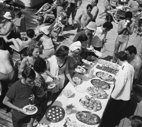 Photograph depicting a bird's eye view of a buffet served on deck