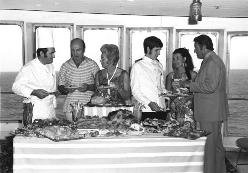 Photograph depicting a group of people at a buffet