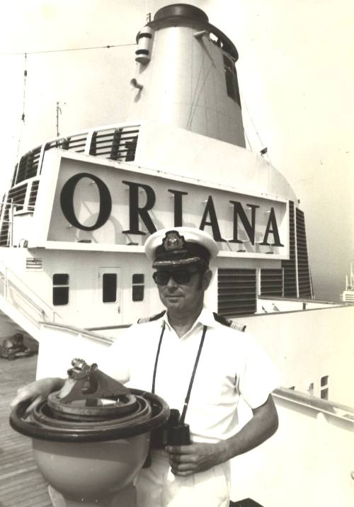 Photograph depicting Captain John Chester on the bridge of ORIANA