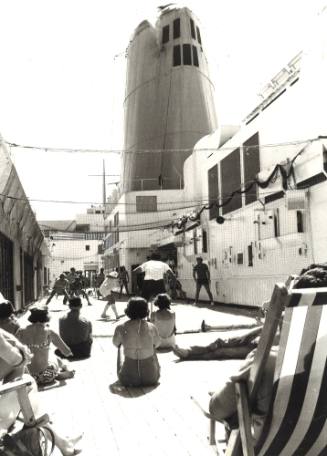 Photograph depicting a game of cricket on a ship's deck