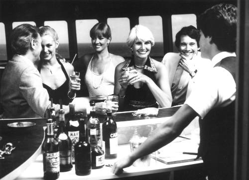 Photograph depicting a group of people at a bar