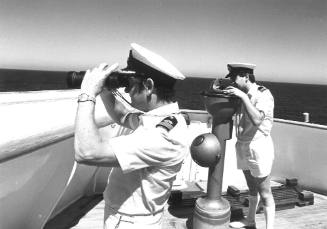 Photograph depicting two officers on ORIANA's bridge