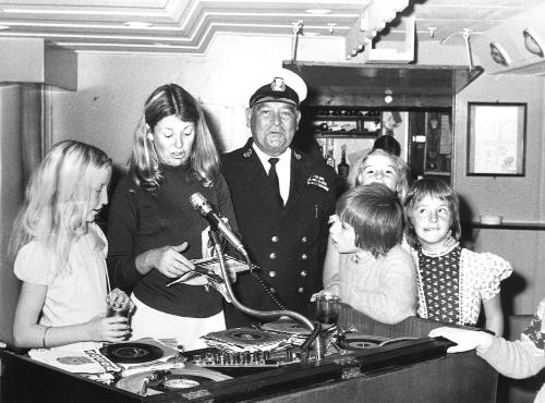 Photograph depicting a group of children selecting music