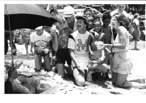 Photograph depicting a group of tourist shopping ashore