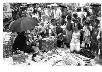 Photograph depicting a group of tourist shopping ashore