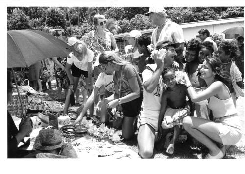 Photograph depicting a group of tourist shopping ashore