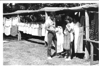 Photograph depicting a couple shopping ashore