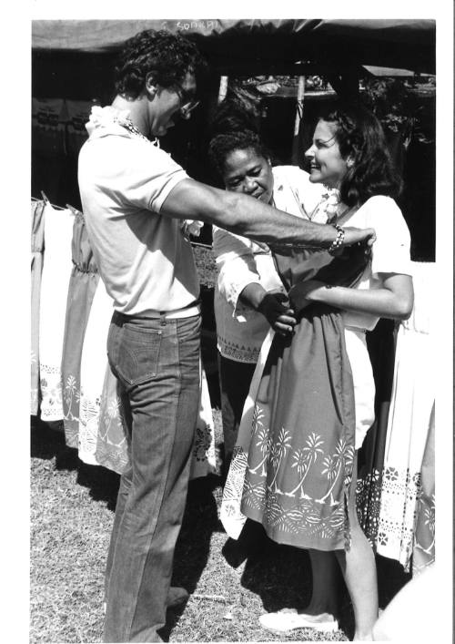 Photograph depicting a couple shopping ashore