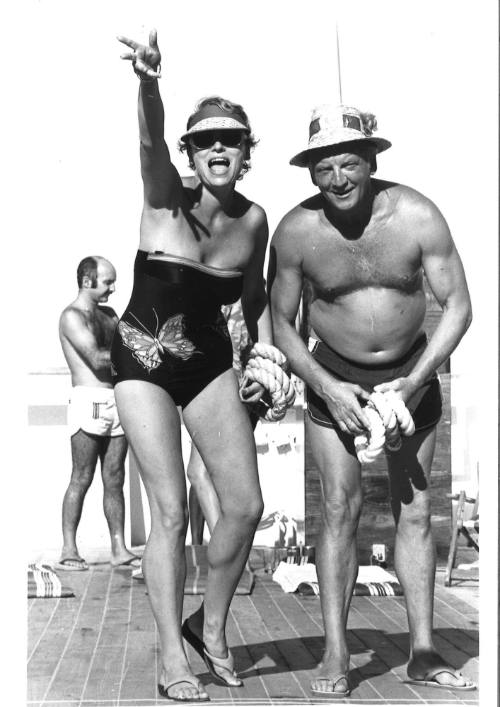 Photograph depicting a couple playing quoits