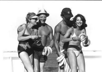 Photograph depicting two couples playing quoits