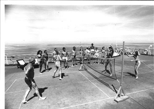 Photograph depicting passengers playing deck tennis