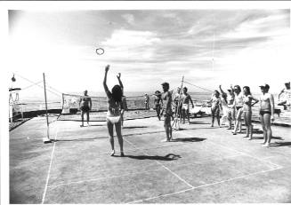 Photograph depicting passengers playing deck tennis
