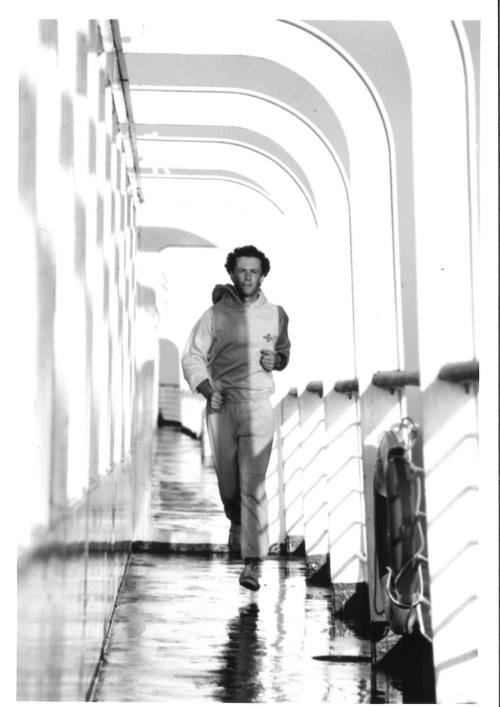 Photograph depicting a man jogging on deck