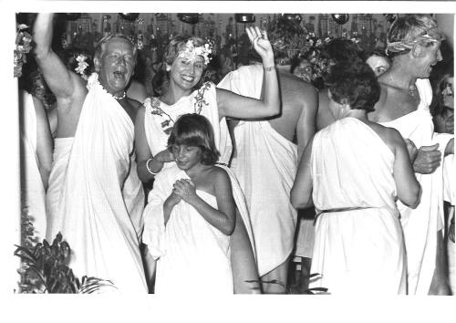 Photograph depicting passengers at a Roman themed party