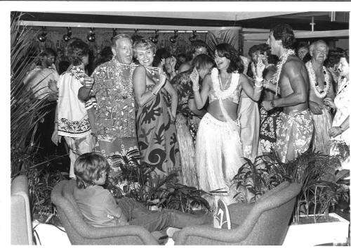 Photograph depicting passengers at a Pacific themed party