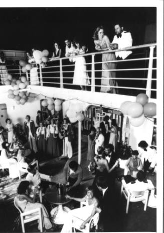 Photograph depicting singers performing on deck