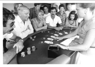 Photograph depicting passengers at the ship's casino