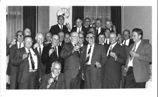 Photograph depicting a group of men posing for the camera