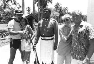 Photograph depicting two couples with a Fijian police officer